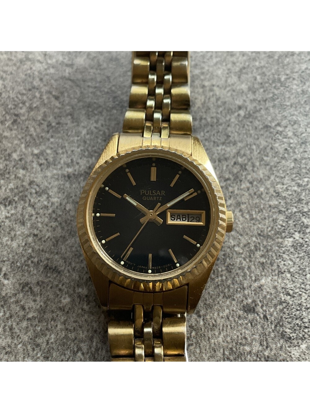 Pulsar Womens Watch V828-0050 24mm Gold Tone Fluted Bezel Black Day/Date Dial J